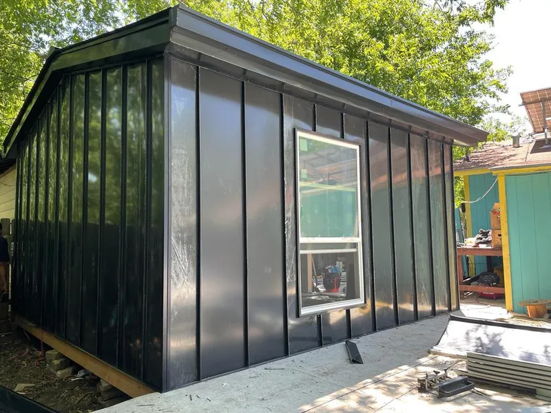 Black standing seam metal wall panels for Roof Inspection in Liberty